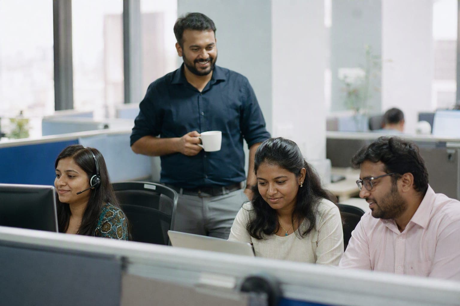 Members of the Depra team working together at their desks
